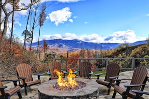 Enjoy the mountain views sitting next to the huge fire pit