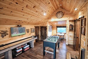 Game room includes Foosball Table, Shuffleboard table, Arcade & board games