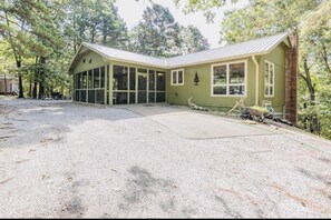 Screened in front porch with a flat screen TV for extra entertainment 
