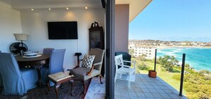 Living room and balcony.  Enjoy the views from the sofa.