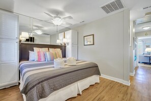 King-sized bed as guests enter the condo.