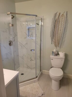This luxury shower and sink bathroom will provide the perfect space for cleanliness.