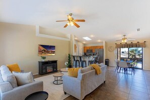 Open concept living room with the dining/kitchen area