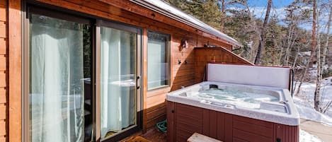 Enjoy your private back deck with hot tub