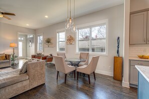 Formal dining space connects to living area and kitchen.