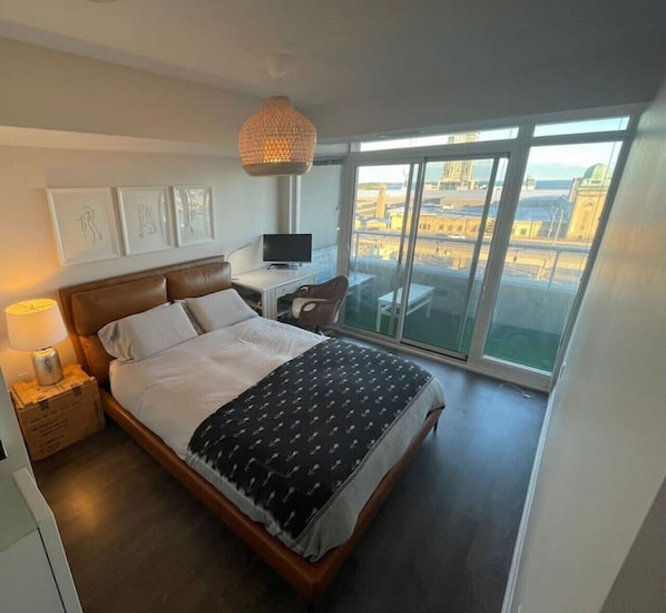 Bedroom featuring cozy Queen sized bed