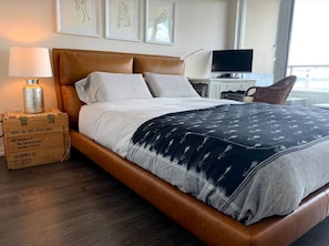 Bedroom featuring cozy Queen sized bed