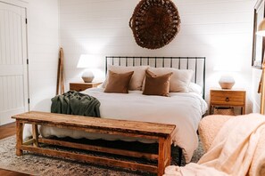 Primary Lower Level Bedroom with King Purple Mattress and Luxury Linens.