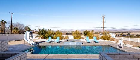 Pool with jacuzzi and lounge chairs (Slide no longer available)