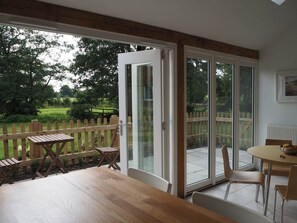 Doors to the private patio from the kitchen diner