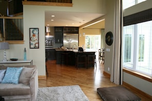 Great flow family room to kitchen. The center staircase leading up & downstairs
