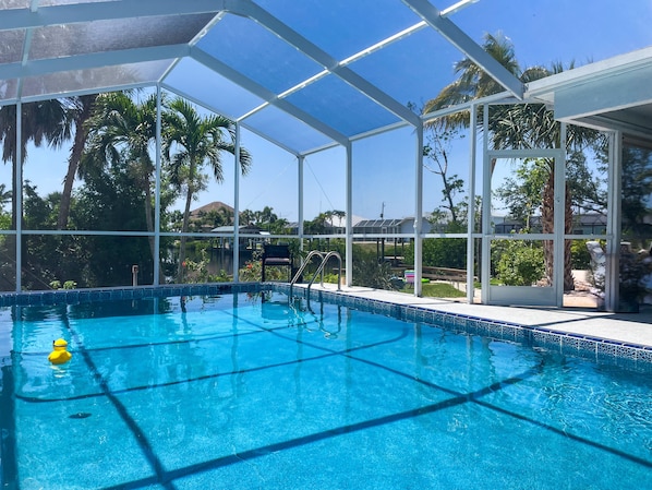 Private heated pool with a beautiful view of the canal and private dock!