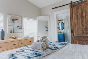 The master bedroom has a large dresser as well as a walk in closet. 