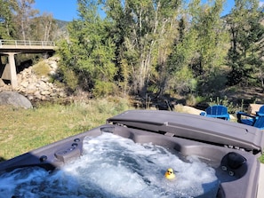 The hot tub has a creek view!