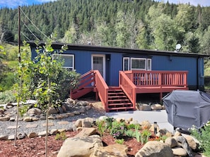 The front deck has mountain/river views, a hot tub and a grill!