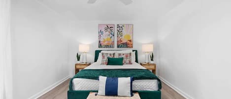 Relax in the cozy front bedroom with chic decor