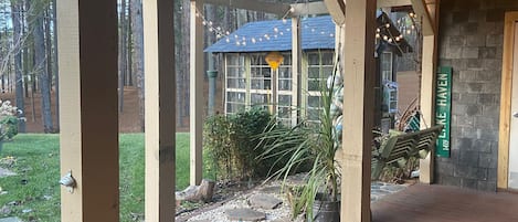 Greenhouse made from old windows and slate roofing. 