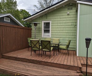 The back yard includes a deck, perfect for outdoor dining.