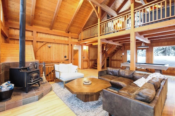 Classic Tahoe chalet living room with a wood burning stove.