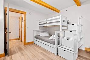 bunk room with two twins and a full