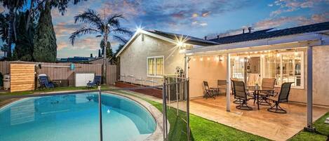 Backyard, Patio with pool. Child safety gate in place.