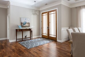 Bright and open entryway with large dining room to the right