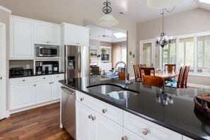 Spacious kitchen with eat in area that seats 6 and 2 at the counter