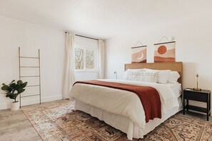well-appointed room with a plush queen-size bed.