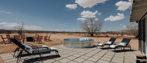 Immerse yourself in the serene desert atmosphere of our outdoor lounge