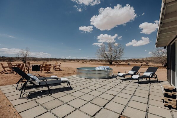 Immerse yourself in the serene desert atmosphere of our outdoor lounge