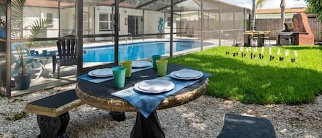 Welcome to Tranquil Times! Enjoy the screened in pool, yard chess, or grill up your favorite meal
