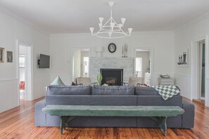 View of living room, please note fireplace is inoperable