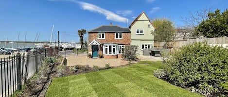 Elmtree Cottage | View of cottage and private driveway from garden