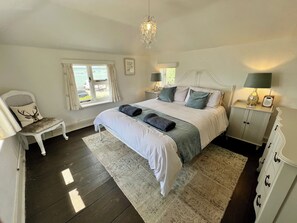 Main Bedroom | Triple aspect view with king size bed and Loaf furniture