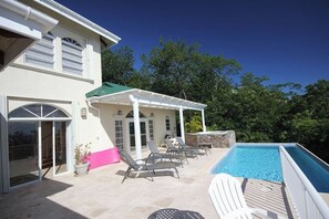 Looking at your pool and sun deck from the outside covered dining area