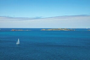 A close up view of a sail boat gliding by
