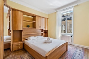 Restful bedroom featuring a comfortable bed and elegant wooden furnishings. Direct bookings: www.arcaproperties.lu
