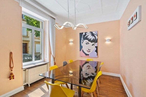 Elegant dining space with artistic touches, perfect for enjoying meals with company.