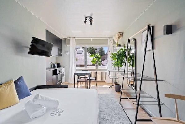 Modern comfort with a view! Cozy up in this bright, airy studio perfect for relaxation.