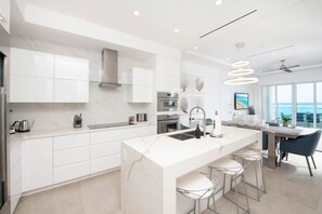 Gourmet kitchen with first class appliances and breakfast bar seating for 3.