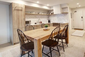 Dining room table, doubles as a convenient work space for those of you who like to work and play!  "Great place. Newly renovated and looks great. Right beside the valley trail and short walk to the gondola."- Mike