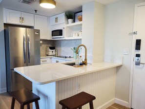 Full kitchen with brand new appliances, airfryer, and  keurig coffee machine. 