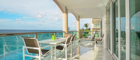 Welcome to our oceanfront haven! Your own private terrace with a coastal backdrop awaits.