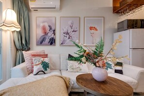 Open plan living area with Air-con beside the kitchen