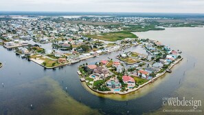 Aerial canal view of the home