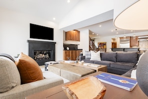 Living Room with Smart TV, sound system, gas fireplace and deck access