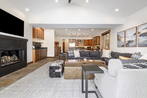 Living Room with Smart TV, sound system, gas fireplace and deck access