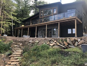 Lakeside of the Lakehouse. 70 foot wide elevated deck for panoramic views.