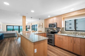 This well-appointed corner condo offers stunning ocean views—even from the beautifully updated kitchen