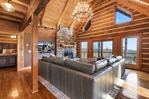 Great Room with Stacked Stone Fireplace, Big Screen, Leather Furniture and VIEWS!